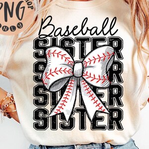 May include: A white t-shirt with a black and white graphic design of a baseball-themed bow and the text "Baseball Sister" repeated three times.