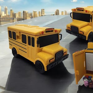 May include: A yellow school bus shaped dice box with a hinged lid. The box is open and filled with colourful dice. The box is made of plastic and has a realistic school bus design.
