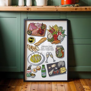 May include: A framed print featuring a colorful illustration of a charcuterie board with various food items. The image includes meats, cheeses, vegetables, bread, and drinks. Text on the print reads "FRIENDS THAT PICK TOGETHER, STICK TOGETHER."