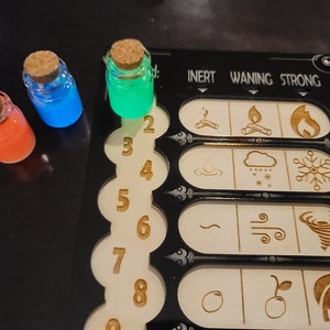 May include: Three small glass bottles with cork stoppers, filled with orange, blue, and green glowing liquids. A wooden game board with etched symbols and numbers is also visible.