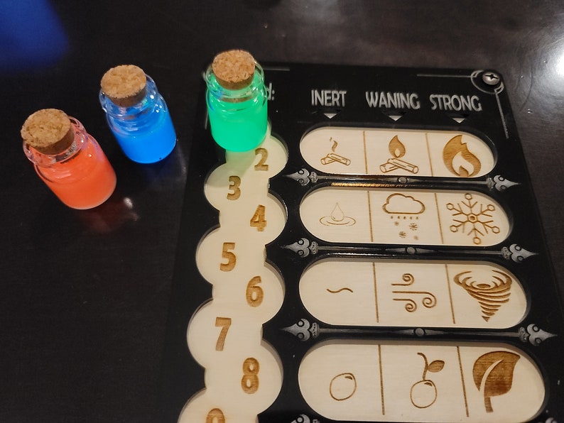 May include: Three small glass bottles with cork stoppers, filled with orange, blue, and green glowing liquids. A wooden game board with etched symbols and numbers is also visible.