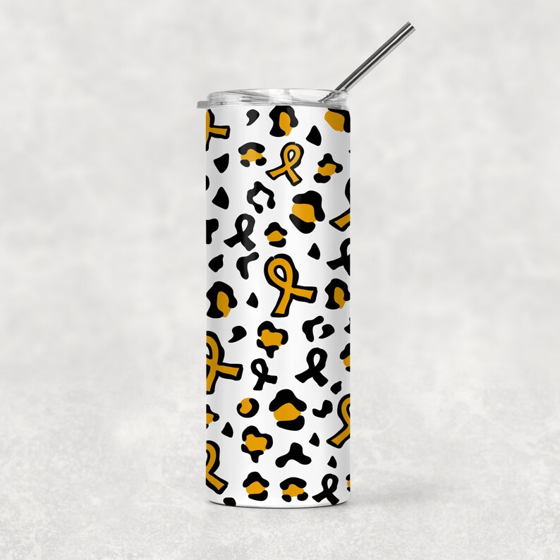 May include: A white stainless steel tumbler with a black and gold leopard print design. The tumbler has a gold ribbon pattern and a straw.