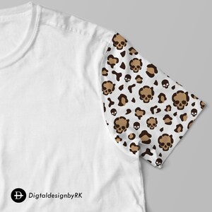 May include: White t-shirt with a brown and white leopard print skull design on the right sleeve.