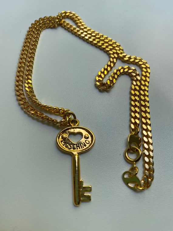 Moschino key pendant with chain