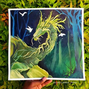 May include: A vibrant painting of a green dragon in a forest setting. The dragon has a long, serpentine body and is surrounded by trees and three white birds. The artwork is set against a dark blue background.