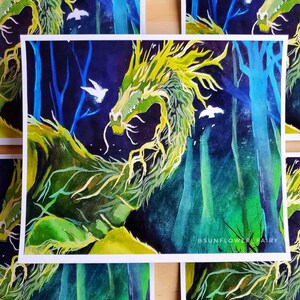 May include: Watercolor painting of a green and yellow dragon in a forest setting with blue trees and white birds. The artwork has a fantasy theme and is signed with the text "#SUNFLOWER FAIRY".