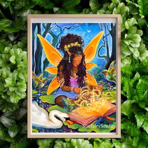 May include: A framed artwork depicts a fairy with orange wings, surrounded by hummingbirds, a swan, and a frog. The fairy is reading a glowing book. The artwork is set in a forest scene with a blue sky and water lilies. The text "SunfairyStudio" is visible.