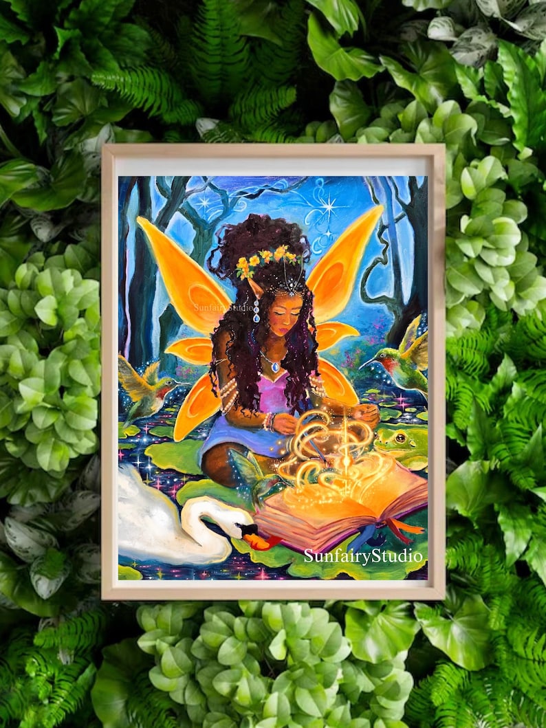 May include: A framed artwork depicts a fairy with orange wings, surrounded by hummingbirds, a swan, and a frog. The fairy is reading a glowing book. The artwork is set in a forest scene with a blue sky and water lilies. The text "SunfairyStudio" is visible.