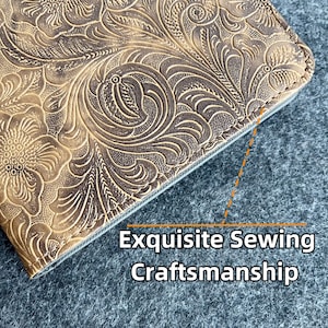 May include: Close-up of the edge of a brown leather wallet with an embossed floral pattern. The stitching is visible and the text "Exquisite Sewing Craftsmanship" is printed below the image.