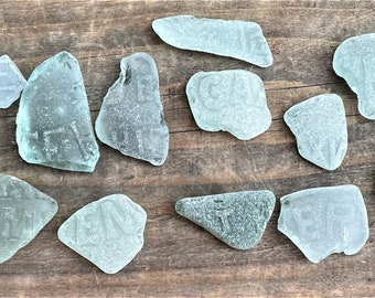 16 x Sea glass, Sea glass with lettering, Collectable glass, Beach glass, Mosaic supplies, Broken bottles.