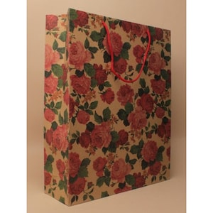 May include: A brown paper gift bag with red floral print and red rope handles.