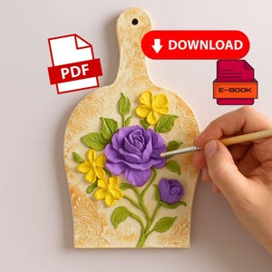May include: A decorative, cream-colored wooden cutting board with a floral design. The board features a large purple rose, yellow flowers, and green leaves. The board has a handle and is being painted with a brush. The image also includes PDF and E-book download icons.