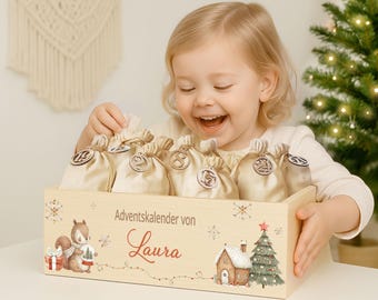 May include: A wooden Advent calendar box with numbered beige pouches. The box is decorated with a squirrel, a house, a Christmas tree, and the name "Laura". A smiling child is opening one of the pouches.
