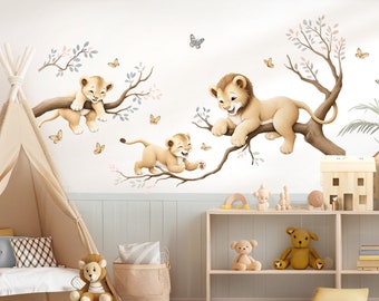 May include: A nursery wall decal set featuring three playful lion cubs on tree branches with butterflies. The decals are a light brown color and are perfect for adding a touch of whimsy to a child's room.