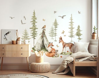 May include: A woodland-themed nursery wall decal set featuring a teepee, trees, a fox, a deer, and birds. The decals are printed on a white background and are perfect for adding a touch of nature to any child's room.
