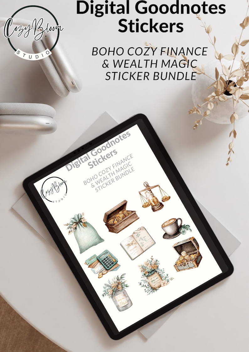 May include: A digital tablet displays a collection of digital stickers. The stickers are themed around finance and wealth, featuring illustrations of scales, treasure chests, and floral arrangements. The text on the screen reads "Digital Goodnotes Stickers".