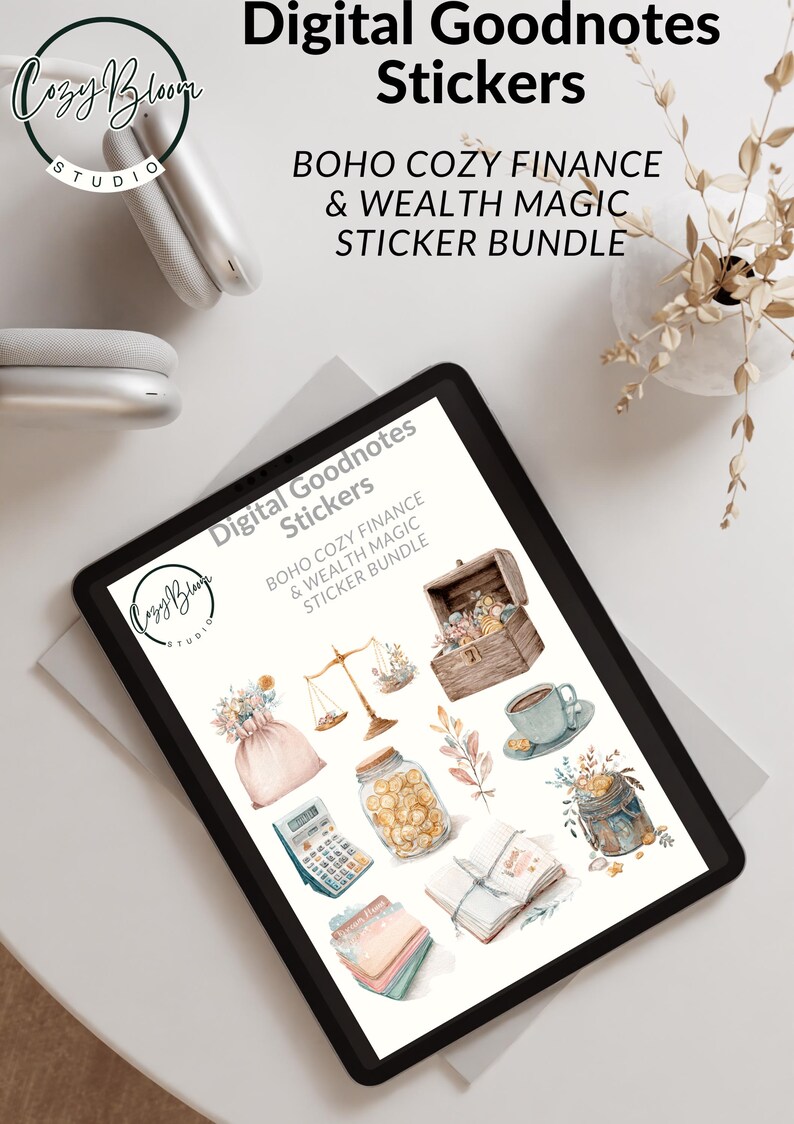 May include: Digital Goodnotes stickers featuring a Boho Cozy Finance & Wealth Magic sticker bundle. The image shows a tablet displaying various watercolor illustrations, including a treasure chest, scales, and a calculator.