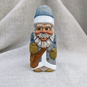 Wood Carving - Hand Carved Santa Claus Figure In A Light-Blue And White Robe - Christmas Carving - Whittling Santa Sculpture With A Gift Bag