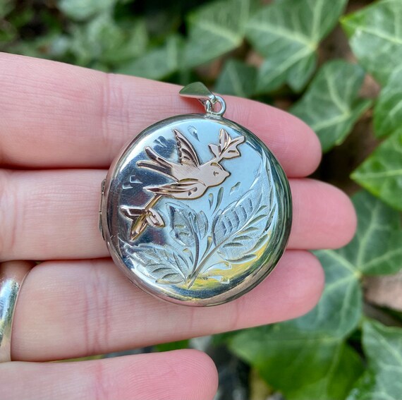 Vintage silver locket with rose gold swallow detai