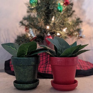 May include: A set of three ceramic nesting bowls in shades of blue, green, and white. The bowls feature a speckled glaze and a simple, modern design. The largest bowl is approximately 7 inches in diameter.