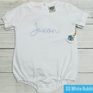 May include: White short-sleeve bubble onesie with blue embroidered text that says "Jaxon".