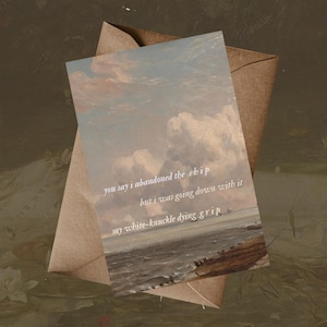 May include: A greeting card with a seascape painting and the text "you say i abandoned the ship but i was going down with it my white-knuckle dying grip." The card is inside a brown envelope.