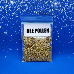 May include: A clear plastic bag with a white label that reads "BEE POLLEN". The bag contains a yellow and brown granular substance.