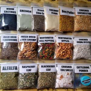 May include: Assortment of small, clear plastic bags filled with various dried ingredients, including worm castings, chia seeds, and dehydrated apples. Each bag has a label with the product name. The image showcases a variety of natural products.