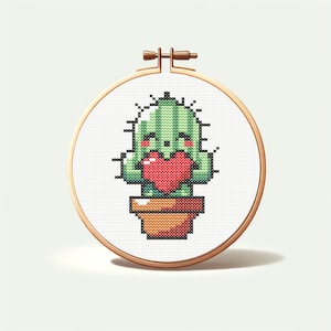 May include: A green cactus with a smiling face holds a red heart in its arms. The cactus is in a brown pot with orange accents. The cactus is embroidered on a white canvas.
