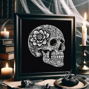 May include: A black and white illustration of a sugar skull with a floral design. The skull is decorated with intricate details and a flower on the side.