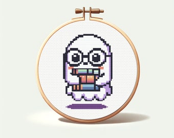 May include: A white ghost wearing glasses and holding a stack of colorful books. The ghost is embroidered on a white canvas with a wooden hoop.