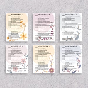 May include: Six printable pages with gratitude prompts numbered 1-150. Each page has a floral design with a light pink, yellow, or blue background. The text is black and white.