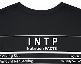 May include: Black t-shirt with white text. The text reads "INTP Nutrition FACTS" above a list of "Serving Size", "Amount Per Serving", "Rarity", and "Quiet" with corresponding values. The shirt is made of a soft material.