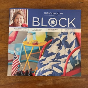 May include: A magazine cover for Missouri Star Quilt Co. titled "BLOCK". The cover features a woman's photo, a blue and white star-patterned quilt, and text including "Beat the Heat with 10 Easy Projects" and "Hexagons Made Easy!"