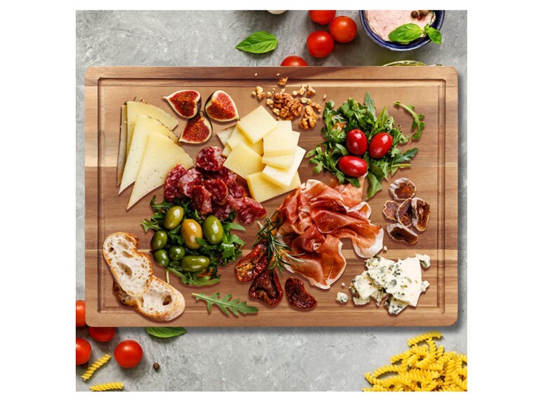May include: A wooden serving board with a variety of food items, including cheese, salami, prosciutto, olives, figs, and dried tomatoes. The board is made of light brown wood and has a natural finish.