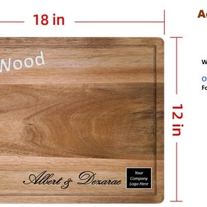May include: A rectangular acacia wood cutting board with the text "Acacia Wood" engraved in white lettering. The board measures 18 inches by 12 inches and has a natural wood grain pattern. The text "Albert & Dexarac" is engraved in black lettering on the bottom of the board. The text "Your Company Logo Here" is also engraved in black lettering on the bottom of the board.