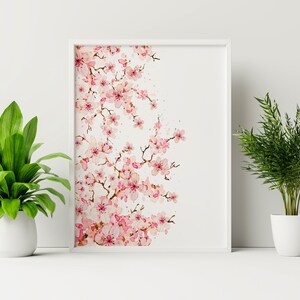 Puede incluir: Una pintura de acuarela enmarcada de una rama de flor de cerezo rosa sobre un fondo blanco.