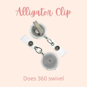 May include: Two clear retractable badge holders with alligator clips. The holders have a silver clip and a clear plastic reel. The text "Does 360 swivel" is printed below the holders.