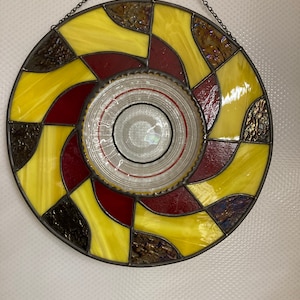 Stained glass panel with clear antique plate and red, amber and black glass