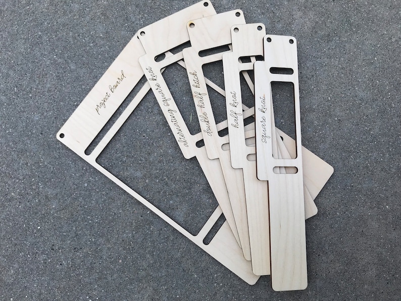 May include: A set of five light-colored wooden macrame tools with laser-engraved text. The pieces are labeled project board, alternating square knot, double half hitch, half knot, and square knot. Each tool features rectangular cutouts and holes.