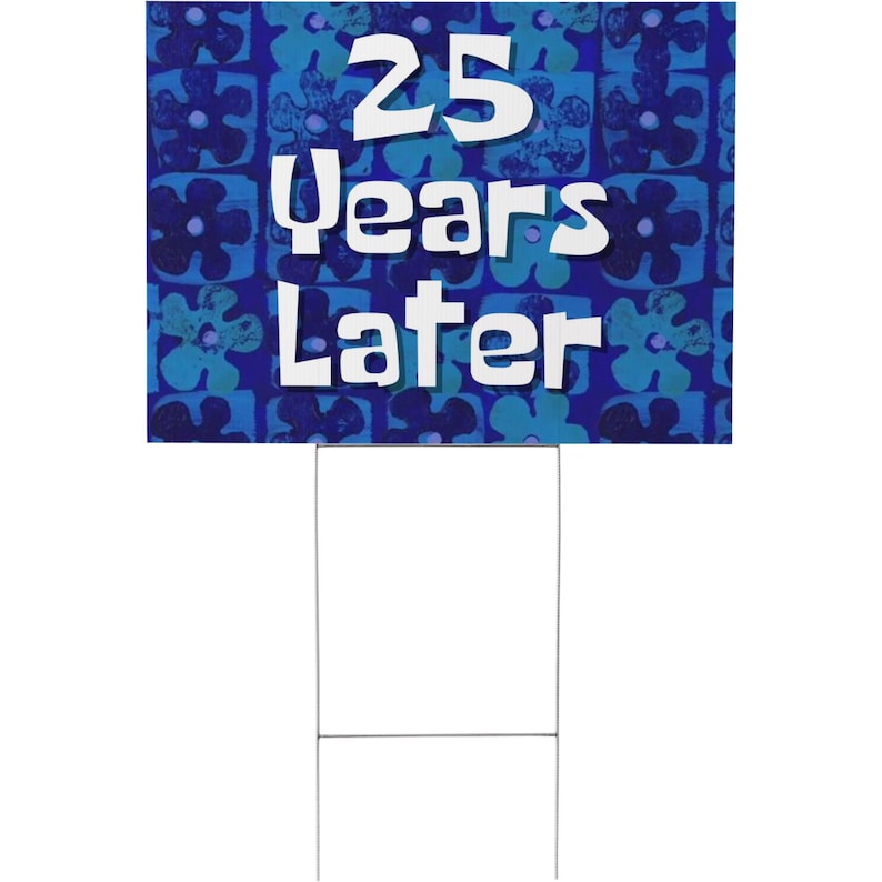 May include: A blue and white yard sign with a blue floral pattern and the text "25 Years Later".