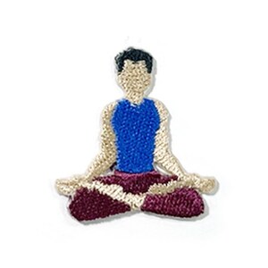 May include: Embroidered patch showing a figure in a seated yoga position. The figure has a blue top, maroon bottoms, and a neutral skin tone. The patch has a textured, stitched design, suitable for application on clothing or accessories.