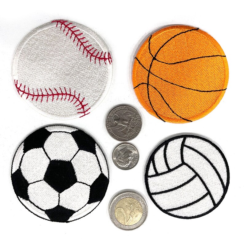 May include: Four embroidered sports patches: a baseball, basketball, football, and volleyball. The baseball is white with red stitching. The basketball is orange with black lines. The football is black and white. The volleyball is white with black lines.