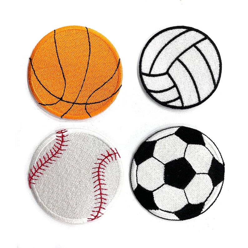 May include: Four embroidered patches depicting sports balls: a basketball, volleyball, baseball, and football. The basketball is orange with black lines. The volleyball is white with black lines. The baseball is white with red stitching. The football is black and white.