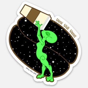 May include: A green alien character holding a brown and white coffee cup, standing on a brown coffee bean with a black starry sky background. The text "Veni Vidi Venti" is written in white on the bean.