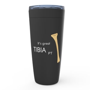 May include: Black travel mug with a white graphic of a bone and the text "It's great TIBIA PT".