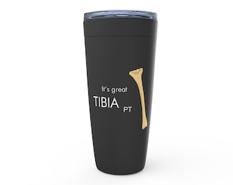 May include: Black travel mug with a white graphic of a bone and the text "It's great TIBIA PT".