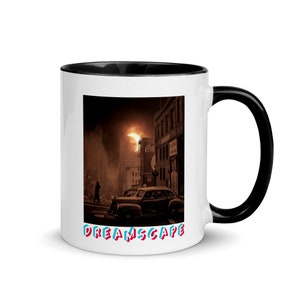 May include: White ceramic mug with a black interior and handle. The mug features a sepia-toned image of a vintage car on a city street with a large moon. The word "DREAMSCAPE" is printed in colorful letters at the bottom.