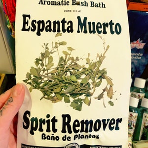 May include: A white package with black text that reads "Aromatic Bash Bath", "Espanta Muerto", "Sprit Remover", and "Baño de Plantas". The package contains dried herbs and is labeled "1 1/2 oz." and "For External Use Only".
