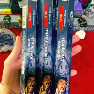 May include: Three boxes of Miracle 365 Sage incense sticks, each containing 20 sticks. The boxes feature a spooky illustration of a person with a terrified expression and the words "Remove Evil Spirits" and "Espanta Espiritu".